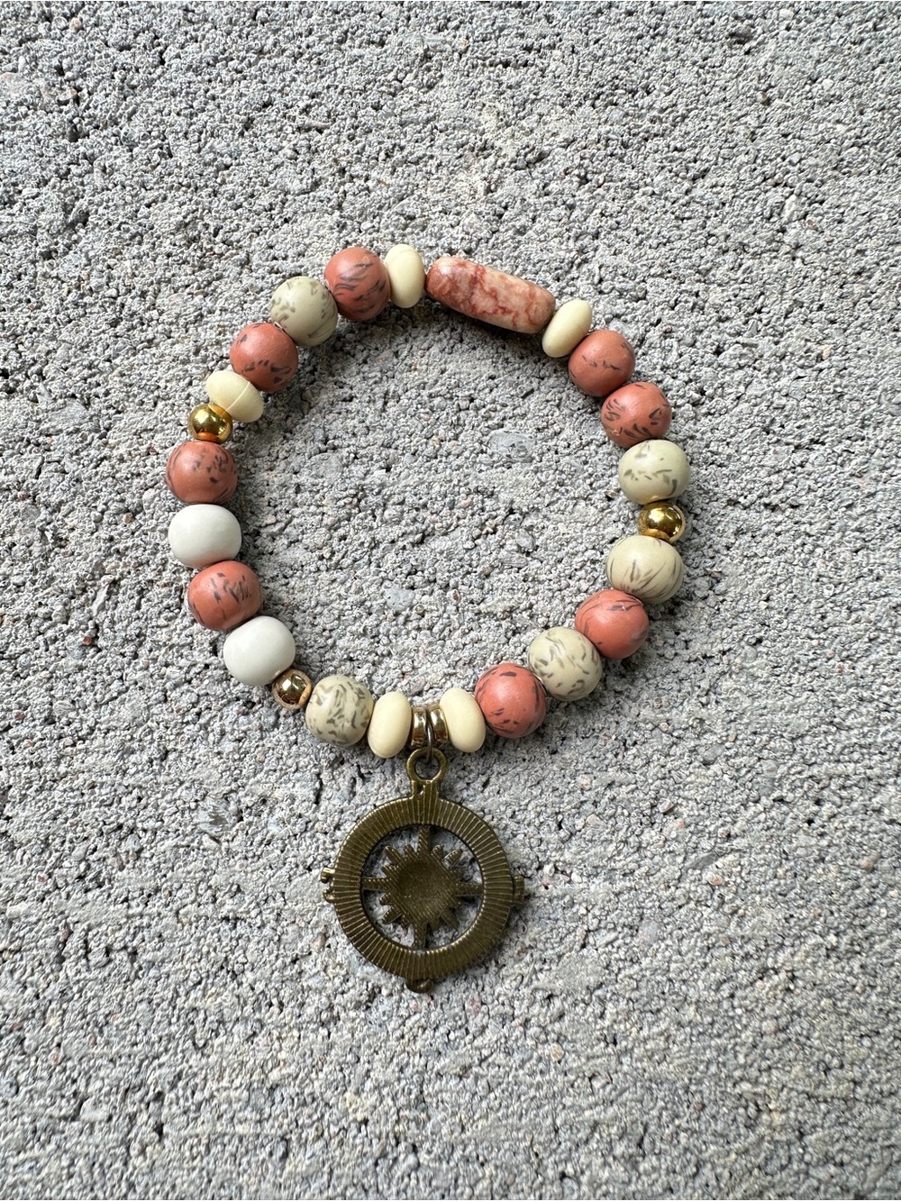 Abrand Gold-Tone Bracelet with Turquoise and Green Beads and sun themed charm